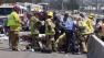 A motorcycle officer was injured in a crash during a funeral procession on the westbound 10 Freeway near Cherry Avenue in Fontana Saturday, August 10, 2013.