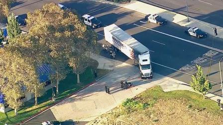 A police officer on a motorcycle was injured in a crash involving a semi truck on Archibald Avenue, just north of the 60 Freeway in Ontario on Tuesday, Oct. 8, 2013.