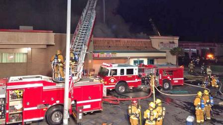 Firefighters appear at the scene of a fire that destroyed the Rinconcito Del Mar restaurant in Victorville on Monday, Oct. 14, 2013.