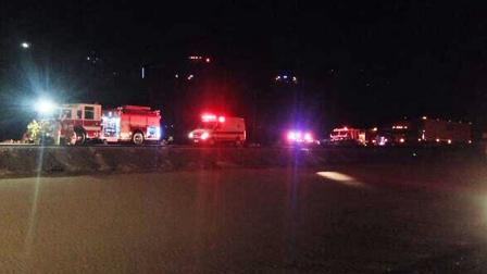 Emergency vehicles are shown along I-40 in the Ludlow area, where a massive gas spill partially closed the freeway in both directions Wednesday, Feb. 26, 2014.