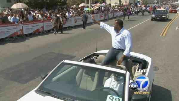 ABC7's Marc Brown waves to the crowd during the Mexican Independence Day Parade on Sunday, Sept. 12, 2010.