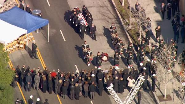 The funeral procession for fallen firefighter Glenn Allen is seen in downtown L.A. on Friday, Feb. 25, 2011.