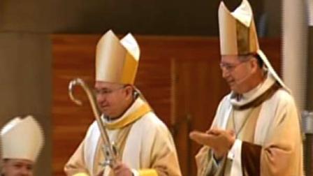 Cardinal Roger Mahony turned over the Los Anegeles archdiocese to Archbishop Jose Gomez on Monday.