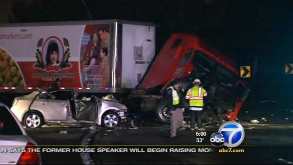 A big rig driver slammed through the center divider on the 60 Freeway just before the 605 interchange and crashed into a car, killing two women on Thursday, Mar. 3, 2011.