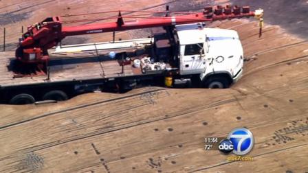 A work truck got stuck in the Gardena Sumps on Monday.