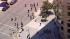 Skateboarders round a corner in downtown Los...