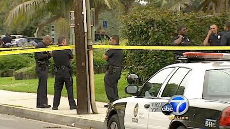 Police investigate the scene of the shooting deaths of two men at Penmar Park in Venice.