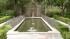 The mansion has beautiful grounds and a...