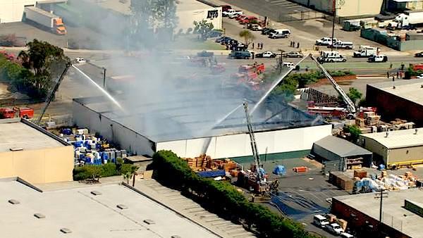 Firefighters battled a large 2-alarm commercial fire that erupted in Rosewood, near Gardena, on Wednesday, August 03, 2011.