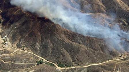 Fire crews battled a fire in Vasquez Rocks Natural Area Park in Los Angeles County on Monday afternoon.
