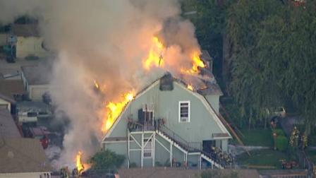 A Los Angeles County firefighter was injured while battling a house fire in South Gate on Friday, Oct. 14, 2011.