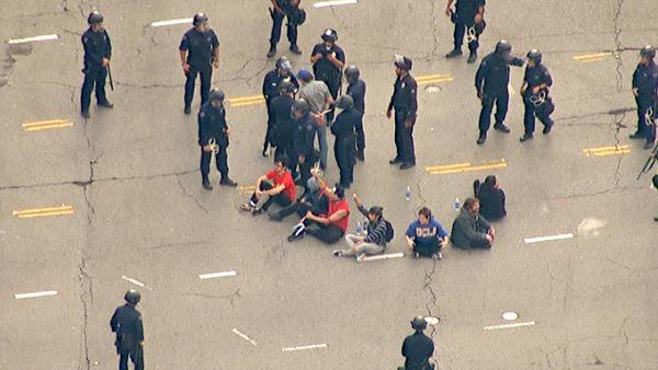 Protesters were arrested after sitting in a circle in the middle of the intersection at Westwood and Wilshire boulevards on Wednesday, Nov. 9, 2011, shutting down the busy roadway.