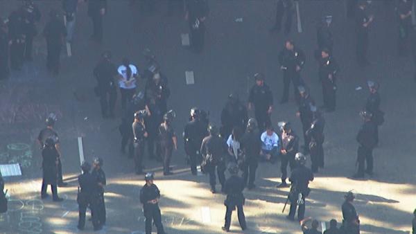 LAPD officers in riot gear move in to clear out Occupy Los Angeles protesters at 4th and Figueroa streets in downtown Los Angeles on Thursday, Nov. 17, 2011.