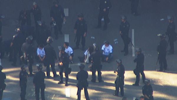 LAPD officers in riot gear move in to clear out Occupy Los Angeles protesters at 4th and Figueroa streets in downtown Los Angeles on Thursday, Nov. 17, 2011.