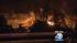 A tanker truck carrying nearly 9,000 gallons of...
