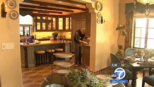 The kitchen is a study in contrasts, from a handmade blue French stove, to a modern microwave oven that opens like a drawer. 

