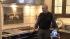 The kitchen is a study in contrasts, from a...