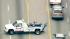 Tow truck drivers makes sudden U-turn :: The driver of a tow truck who led officers on a slow pursuit through the L.A. area Tuesday made a sudden U-turn