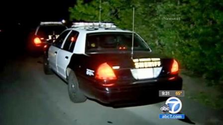 A Los Angeles Sheriffs Department patrol vehicle is parked near the scene where a womans body was found in a garage in the 23000 block of Moon Shadows Drive in Malibu on Saturday, April 28, 2012.