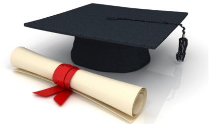 A graduation cap and diploma are seen in this undated file photo.