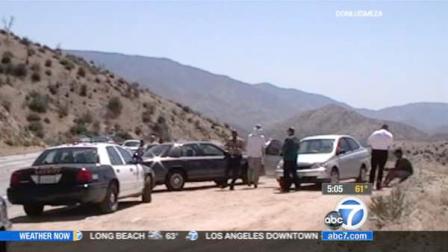 Law enforcement patrol cars are shown near Mt. Emma Road and Angeles Forest Highway in Acton, Calif., where a kidnapping victim was found on Thursday, May 31, 2012.