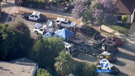 Authorities set up a perimeter in a Glendale neighborhood on Thursday, June 14, 2012, to search for a shooting suspect.