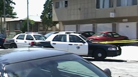 Police park at an apartment complex in Long Beach, where a woman was killed on Sunday, July 1, 2012.