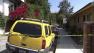 Crime tape is seen at a house where police were investigating a home-invasion robbery on Monday, July 2, 2012.