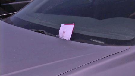 A car with a parking ticket is seen in this file photo.