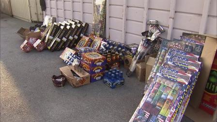 A Downey couple was arrested on suspicion of trying to sell illegal fireworks, seen in this photo, out of their home.