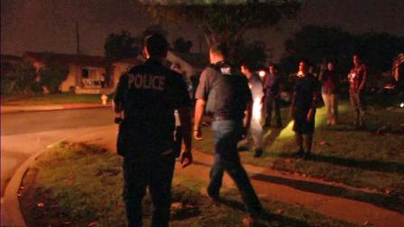 Officials from Monterey Park police and fire are seen in a neighborhood where illegal fireworks were set off Wednesday, July 4, 2012.