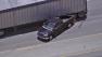The bed of a pursuit suspects truck is seen stuck under a big rig after the driver lost control of the vehicle following a PIT maneuver during a pursuit on Tuesday, July 10, 2012.