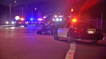 Los Angeles County sheriffs deputies investigate the scene of a crash in Diamond Bar on Sunday, July 15, 2012.