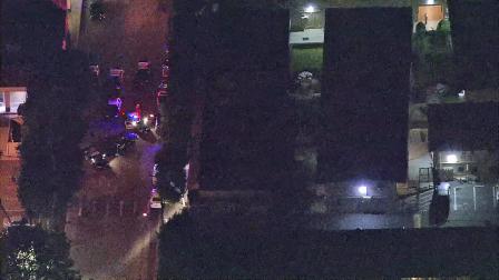 Authorities are seen at an apartment building in El Monte where a man holed himself up for hours Thursday, July 26, 2012.
