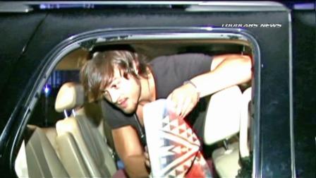 A man cleans his vehicle that was broken into in Hollywood on Friday, August 03, 2012.