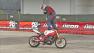 A motocyclist is seen performing a stunt on a motocycle on the Queen Mary Friday, August 3, 2012.