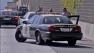CHP officers are seen at the site of an officer-involved shooting that shut down the westbound 60 Freeway at Hacienda Boulevard on Saturday, August 4, 2012.