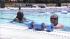 Two women hang out in a pool during a warm summer day on Monday, Aug. 6, 2012.