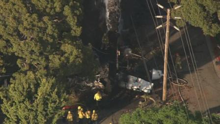 A small plane is seen after it crashed in Westwood on Friday, August 10, 2012.
