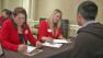 An applicant speaks with Target workers at a job fair in West Los Angeles on Thursday, Aug. 16, 2012.