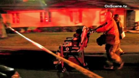 A boy is wheeled away by emergency personnel after he suffered a gunshot wound during a shooting at the Avalon Gardens apartments in Los Angeles on Saturday, Aug. 18, 2012.
