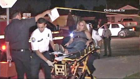 A pregnant woman is seen being taken to an ambulance in Norwalk after she allegedly stabbed her live-in boyfriend on Monday, August 28, 2012. The woman complained of discomfort after the alleged incident and was taken to the hospital.