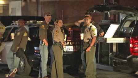 Los Angeles County sheriffs investigators are shown at the scene of a barricade situation in Carson on Wednesday, Aug. 29, 2012.