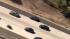 A car is seen speeding on the freeway during a...