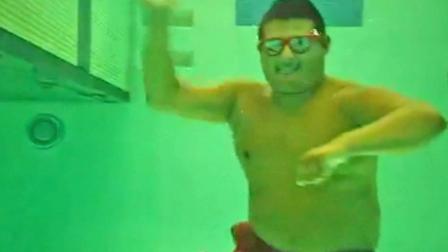 An El Monte lifeguard is seen underwater during a video the group made using the popular Gangnam Style song. The lifeguards were later fired for making the video.