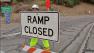 A worker gets ready to close a ramp to the southbound 405 Freeway on Friday, Sept. 7, 2012.