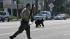A bear runs down the street near La Crescenta in...
