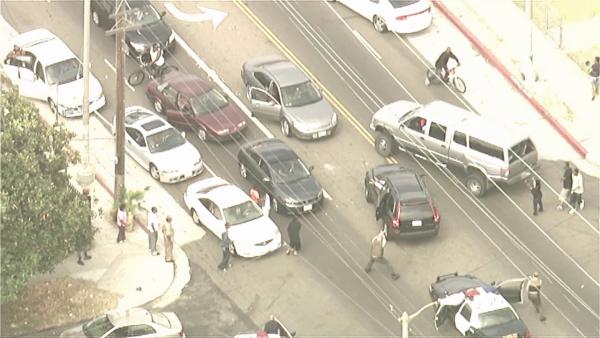 Deputies take bank robbery suspects into custody in South Los Angeles at the end of a wild pursuit on Wednesday, Sept. 12, 2012.