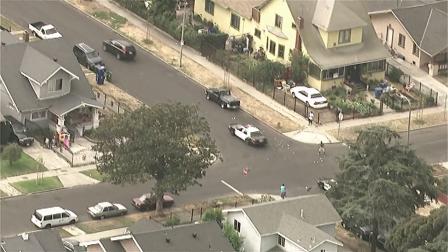Bank robbery suspects in a Volvo SUV are seen throwing money out the windows while police are in pursuit in South Los Angeles on Wednesday, Sept. 12, 2012.