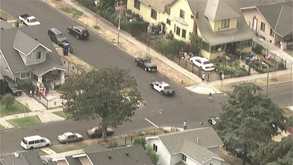 Bank robbery suspects in a Volvo SUV are seen throwing money out the windows while police are in pursuit in South Los Angeles on Wednesday, Sept. 12, 2012.